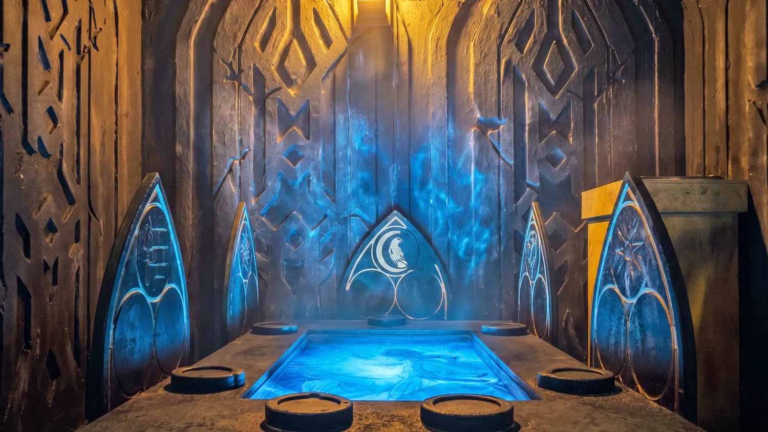 Ornate MindTrap escape room booths in a neon-lit arcade